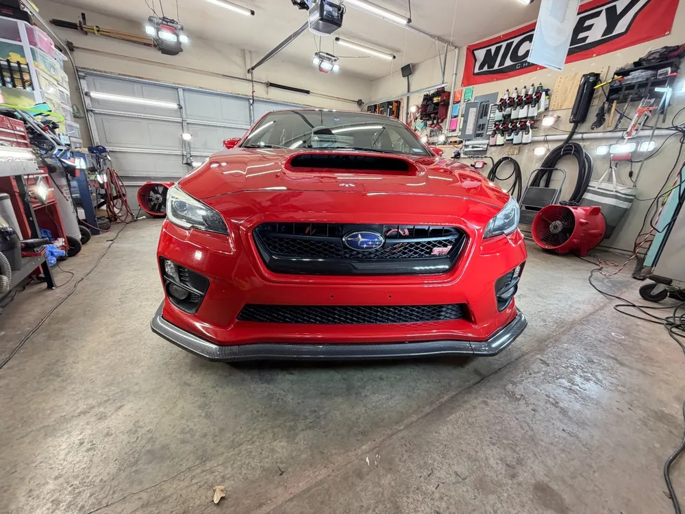 Red Subaru WRX STI front after paint correction